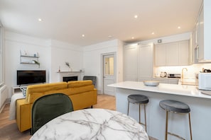 Standard Apartment | Living area | 30-inch LED TV with cable channels