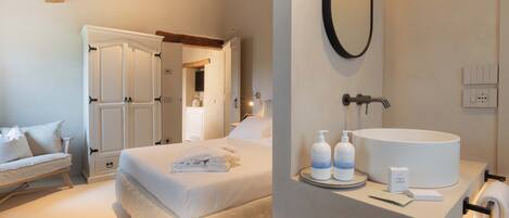 A bedroom with a bed, bedside table, and a wardrobe.