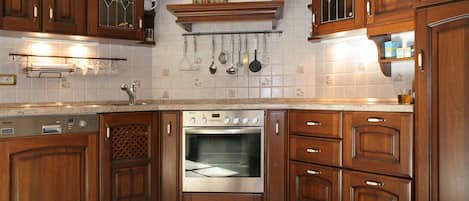 Fridge, stovetop, dishwasher, coffee/tea maker