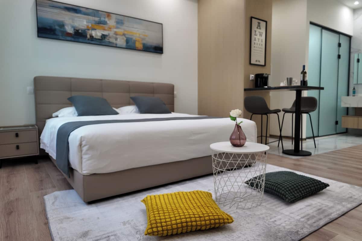 Economy Double Room, 1 Queen Bed | Pillow-top beds, free minibar, laptop workspace, blackout curtains