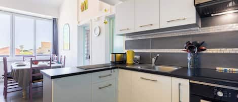 Fridge, stovetop, coffee/tea maker, cookware/dishes/utensils