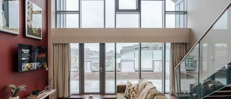 Grand Apartment | Living area | 38-inch Smart TV with cable channels