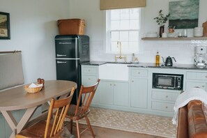 Fridge, microwave, stovetop, coffee/tea maker