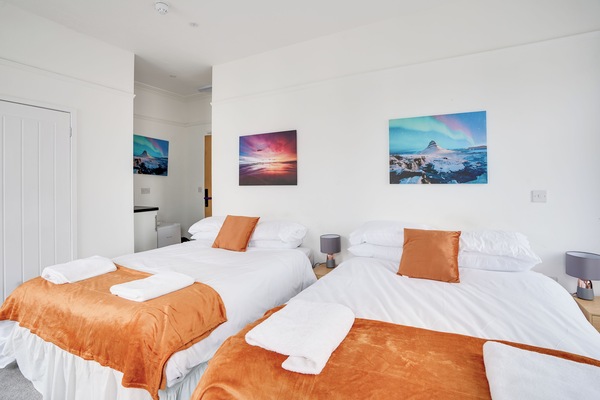 Family Room, 2 Double Beds | Iron/ironing board, WiFi (free), bed sheets
