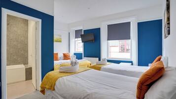 Family Room | 1 bedroom, iron/ironing board, free WiFi, bed sheets