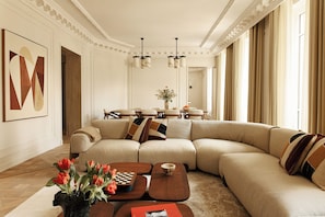 Luxury Apartment, City View | Living area | 65-inch Smart TV with cable channels, streaming services