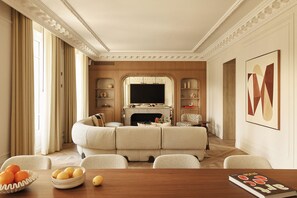 Luxury Apartment, City View | Living area | 65-inch Smart TV with cable channels, streaming services