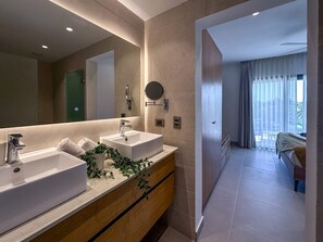 A modern bathroom with two sinks, a mirror, and a potted plant. - Exclusive Penthouse With Picuzzi Steps From Beach (Punta Cana)