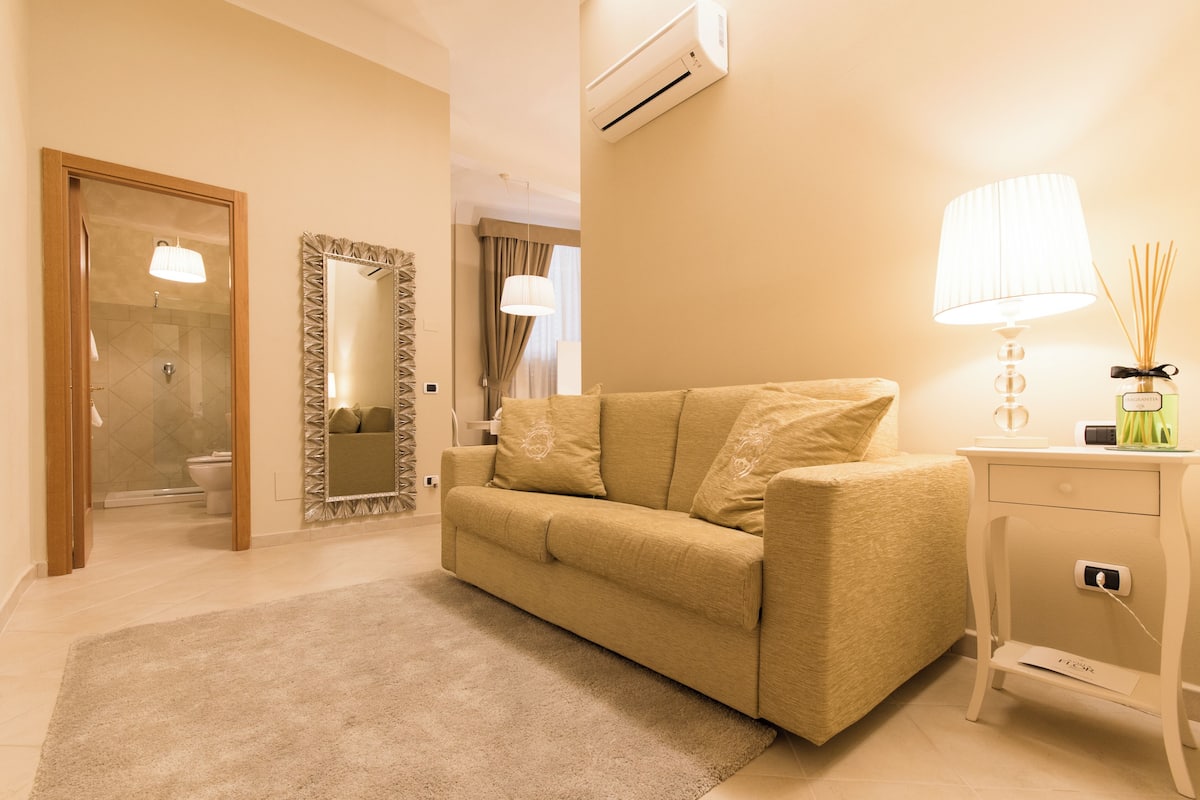 Family Apartment | Living area | 15-inch flat-screen TV with digital channels