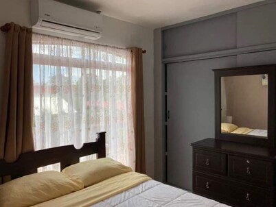 Charming 2-bedroom house with AC and WiFi in a quaint neighborhood.