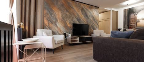 Appartement Confort | Aire de séjour | Téléviseur à écran plat
