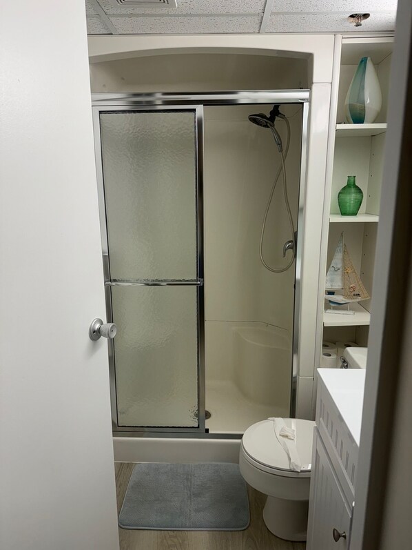 Shower, hair dryer, towels, soap
