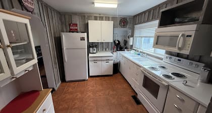 Cozy 2-bedroom cabin in Gilbert. Located close to RockHouse and Devil Anse Trail