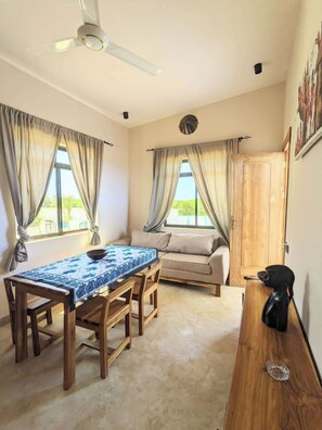 Appartement, uitzicht op zee | Woonruimte