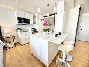 Fridge, microwave, stovetop, coffee/tea maker