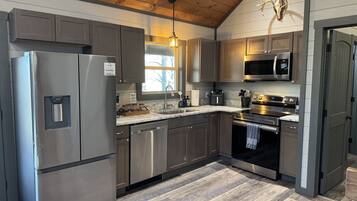 Coffee/tea maker, fridge, microwave, oven