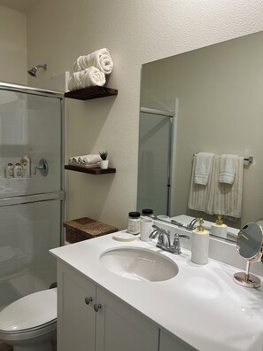 Shower, hair dryer, towels, soap