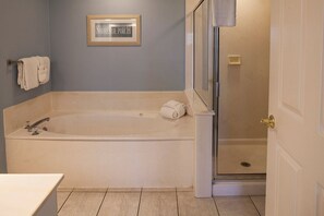 Shower, jetted tub, towels, soap