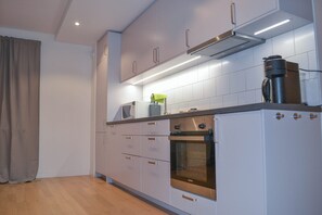 Apartment | Private kitchen | Fridge, microwave, oven, stovetop
