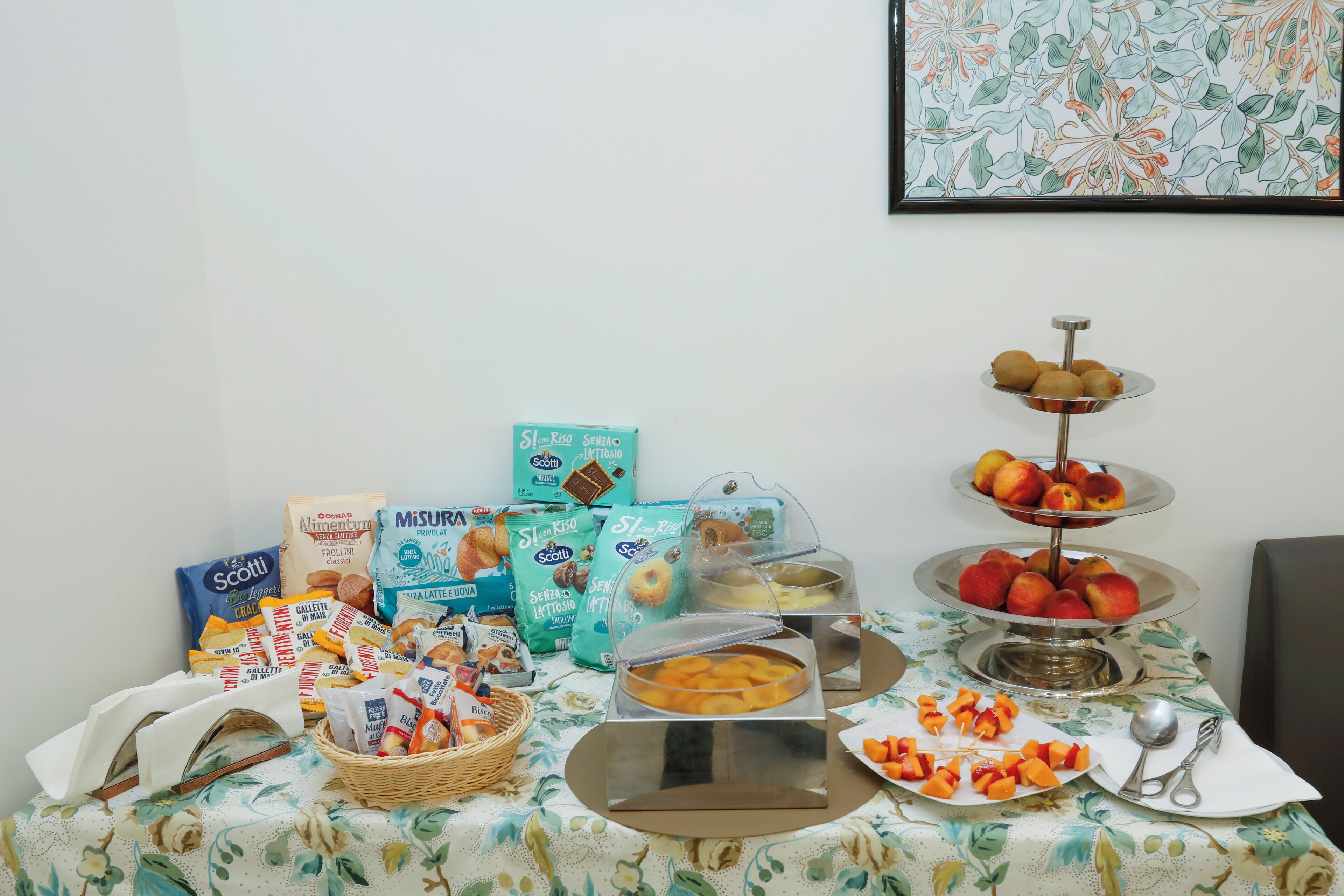 A breakfast buffet with various food items and condiments.