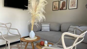 Departamento Confort, vista a la ciudad | Área de sala de estar