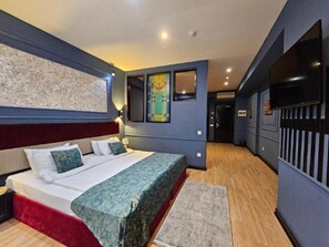 Executive Triple Room, City View | Premium bedding, minibar, in-room safe, individually decorated