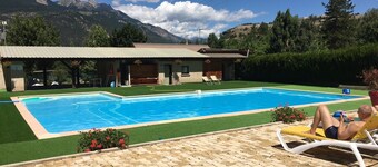 Mountain chalet with pool access, children's play area, restaurant and pizzeria.