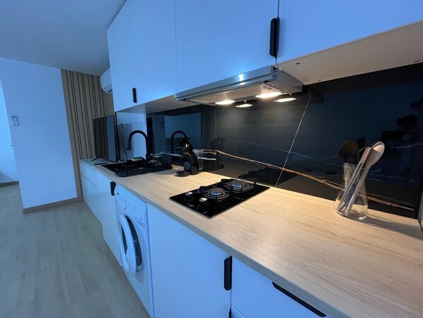 Fridge, microwave, stovetop, coffee/tea maker