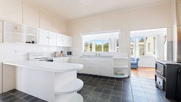 Oven, stovetop, toaster, dining tables