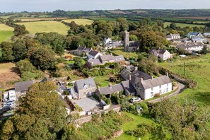 A rural village with stone houses, a church, and open fields. - Two Hoots - Peaceful Cottage Rural Views (Pembroke)