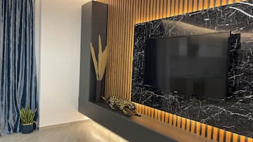 Appartement Deluxe | Coin séjour | TV connectée