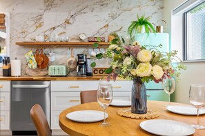 Enjoy cooking in this well-equipped kitchen with a dishwasher, coffee maker, and toaster.