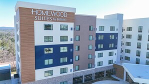 A multi-story hotel with 'HOMEWOOD SUITES by Hilton' signage, a mix of window styles, and a flat roof design. - Homewood Suites By Hilton Hoover Birmingham (Birmingham)