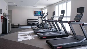 A gym with treadmills, dumbbells, and exercise equipment. - Hilton Garden Inn Hoover Birmingham (Birmingham)