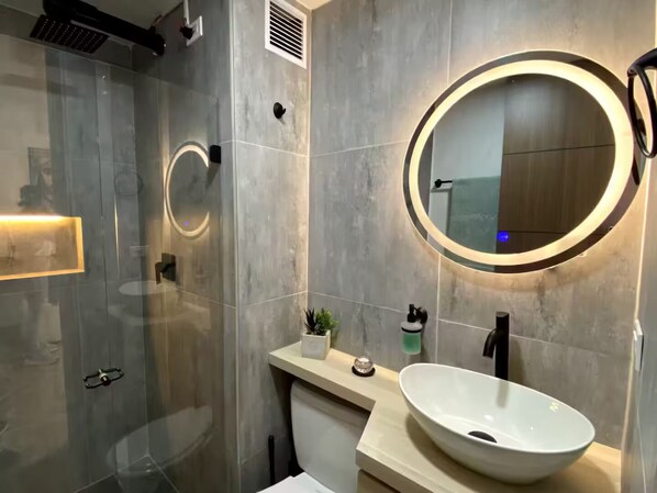 Shower, hair dryer, towels, soap