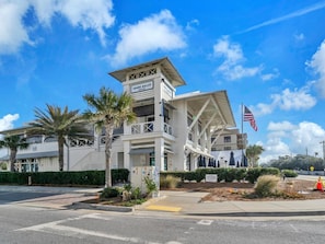 A white building with a sign reading "Shank Gulley" and a flag.
