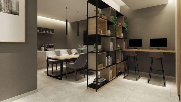 A modern interior with a dining area, a bookshelf, and a desk with two monitors. - Home Inn (Sheyang Renmin Road) (Sheyang)