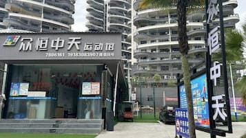 A multi-story residential building with balconies.