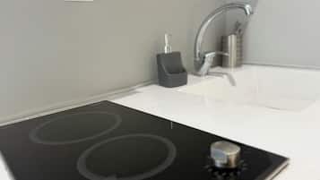 Mini-fridge, microwave, stovetop, cookware/dishes/utensils