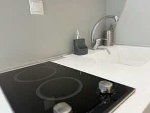 Mini-fridge, microwave, stovetop, cookware/dishes/utensils - DOM SUITES (Daratsos)