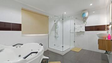Shower, jetted tub, hair dryer, towels