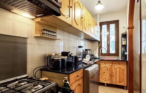 Fridge, stovetop, dishwasher, coffee/tea maker