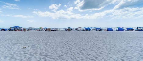 On the beach, sun loungers, beach towels
