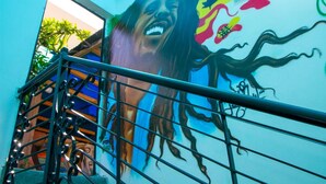 A staircase with a mural on the wall. - dakar International House (Dakar)