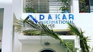 A building entrance with a sign reading "DAKAR INTERNATIONAL HOUSE". - dakar International House (Dakar)