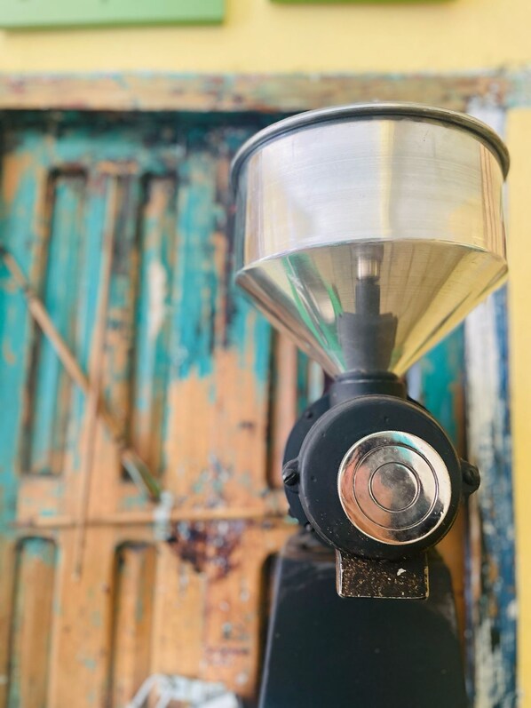 A close-up of a metal funnel-like object with a circular base, possibly a part of a machine or equipment. - San Cristóbal Bleisure Hotel (San Cristóbal de las Casas)