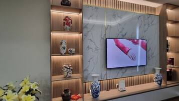 Apartment, 2 Bedrooms, City View | Living area | 55-inch flat-screen TV with cable channels, Netflix, streaming services