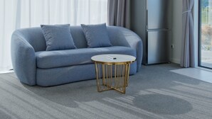 A modern living room with a grey sofa, a small round table, and a built-in fridge. - Starry Heaven 2bdr2ba (Lake Tekapo)