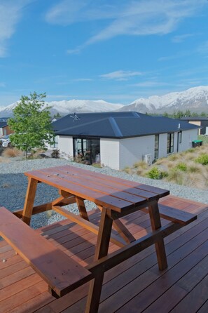 Enjoy a serene view of the surrounding landscape from this resort's outdoor deck.