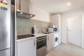 Coffee/tea maker, fridge, microwave, oven